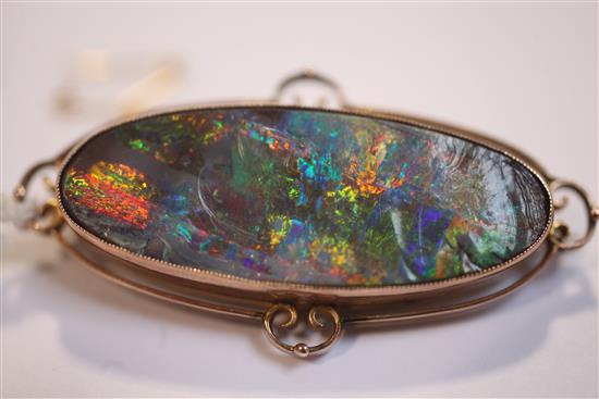 An Edwardian 9ct gold and black opal brooch, 51mm.